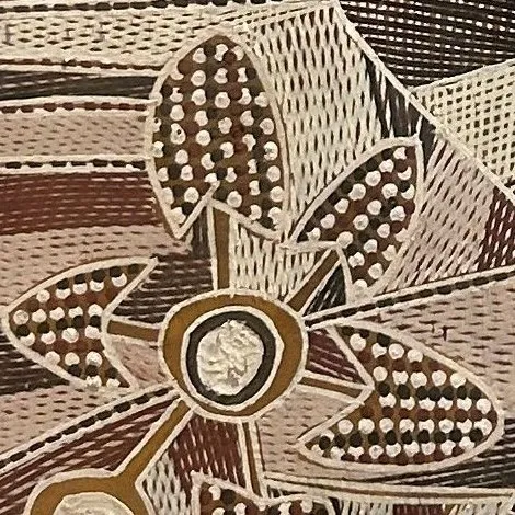 A close-up of the bark painting showing fine rarrk cross-hatching in white, red and black around a flower-like form